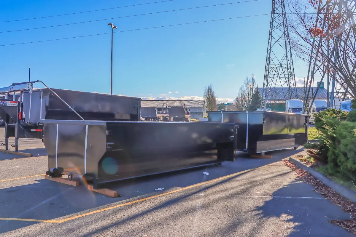 Roll-off dumpster ready for waste disposal at job site for 3 Yard Dumpster Rental in Norwood